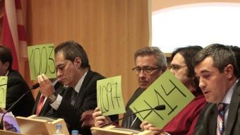 Ramon Vilaró, Josep Maria Vallbona, Josep Delgado i Joaquim Torrecillas, en la junta d'accionistes del desembre.  LL. SERRAT