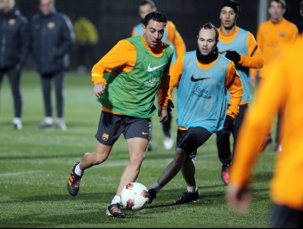 Xavi i Iniesta, durant l'entrenament d'ahir a la Ciutat Esportiva FCBARCELONA.CAT