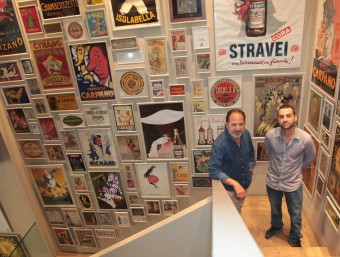 Joan Tapias and son with posters.  J. FERNÀNDEZ