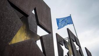 A EU flag flying next to the monument commemorating the Schengen Treaty in Luxembourg.  EFE
